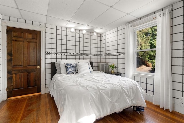 349 Pleasant St, Milton, MA 02186 - bedroom featuring a paneled ceiling and hardwood / wood-style floors