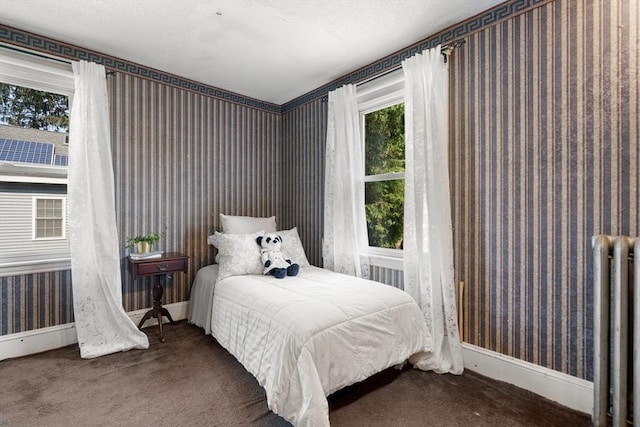 349 Pleasant St, Milton, MA 02186 - carpeted bedroom featuring wallpapered walls and radiator