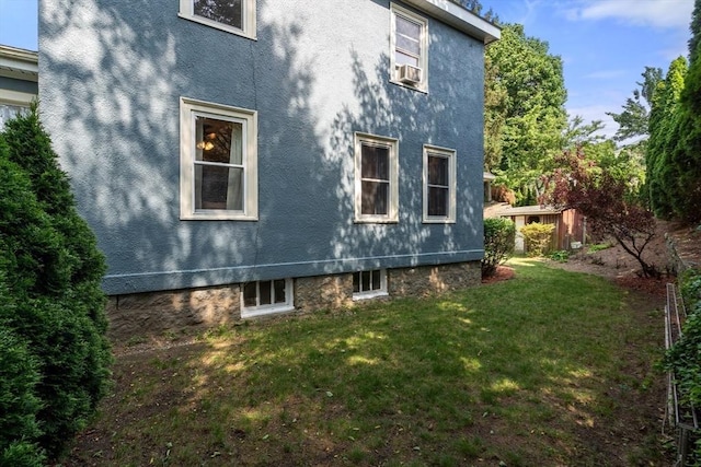 349 Pleasant St, Milton, MA 02186 - view of side of home with a yard and stucco siding