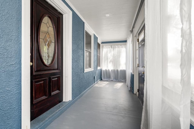349 Pleasant St, Milton, MA 02186 - view of exterior entry with a porch and stucco siding