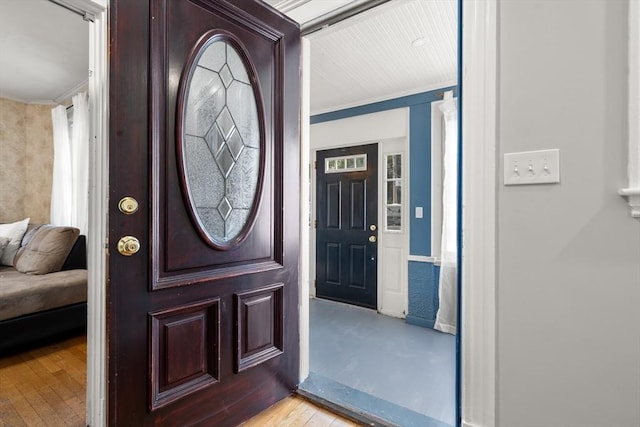 349 Pleasant St, Milton, MA 02186 - entrance foyer with light wood finished floors and crown molding