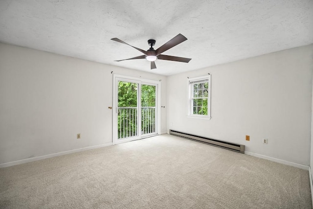 585 Turnpike St Unit 13, Easton, MA 02375 - carpeted spare room featuring baseboard heating, a ceiling fan, baseboards, and a textured ceiling