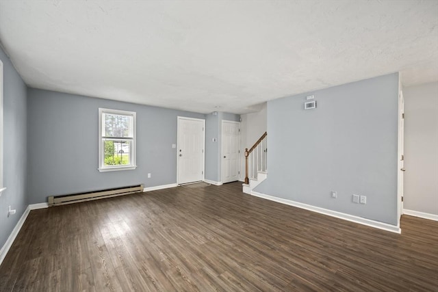 585 Turnpike St Unit 13, Easton, MA 02375 - unfurnished living room featuring a baseboard heating unit, stairway, dark wood finished floors, and baseboards