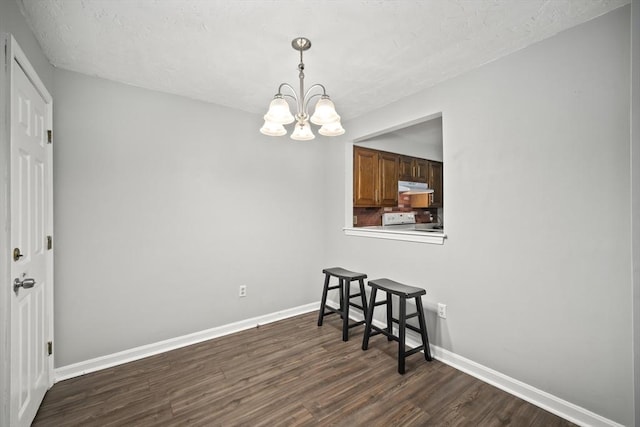 585 Turnpike St Unit 13, Easton, MA 02375 - dining area featuring dark wood-style floors, a chandelier, and baseboards
