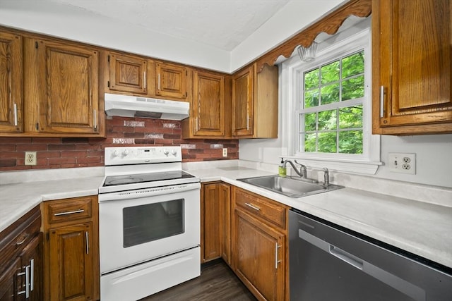 585 Turnpike St Unit 13, Easton, MA 02375 - kitchen with under cabinet range hood, white electric stove, stainless steel dishwasher, a sink, and light countertops