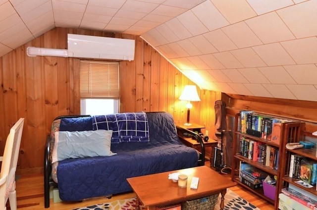 24 Dorothy Ave, Dracut, MA 01826 - living area featuring lofted ceiling, wooden walls, and wood finished floors