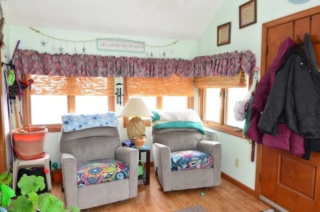 24 Dorothy Ave, Dracut, MA 01826 - bedroom featuring multiple windows, lofted ceiling, and wood finished floors