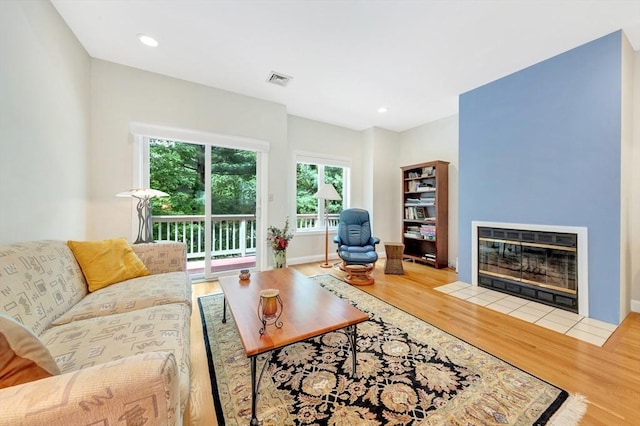 14 Michaels Grn Unit 14, Woburn, MA 01801 - living room with wood finished floors, a fireplace with flush hearth, recessed lighting, and baseboards