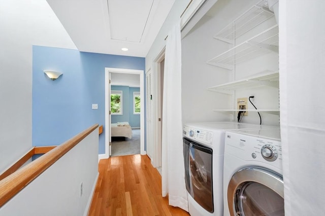 14 Michaels Grn Unit 14, Woburn, MA 01801 - washroom featuring washing machine and clothes dryer, attic access, light wood-type flooring, recessed lighting, and baseboards