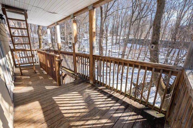 view of snow covered deck