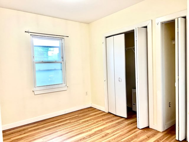 unfurnished bedroom with light hardwood / wood-style floors