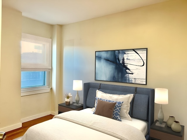 bedroom featuring dark hardwood / wood-style flooring