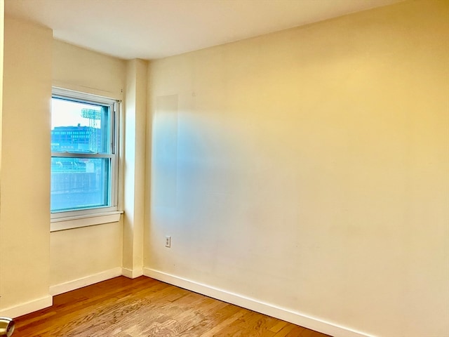 unfurnished room featuring hardwood / wood-style floors