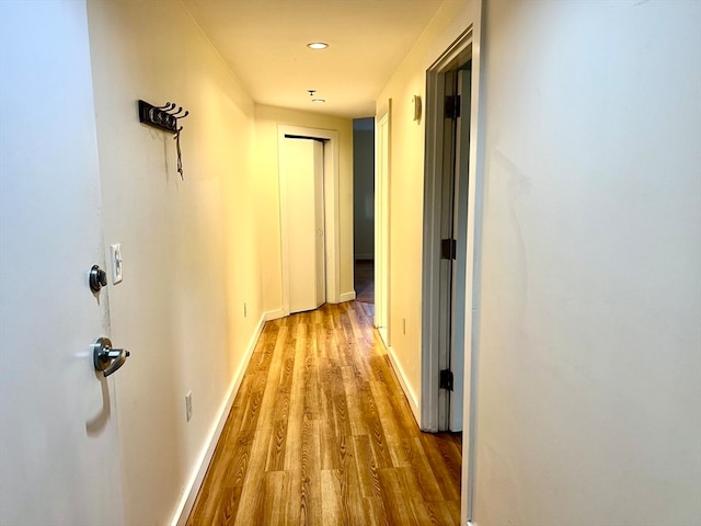 corridor featuring hardwood / wood-style floors