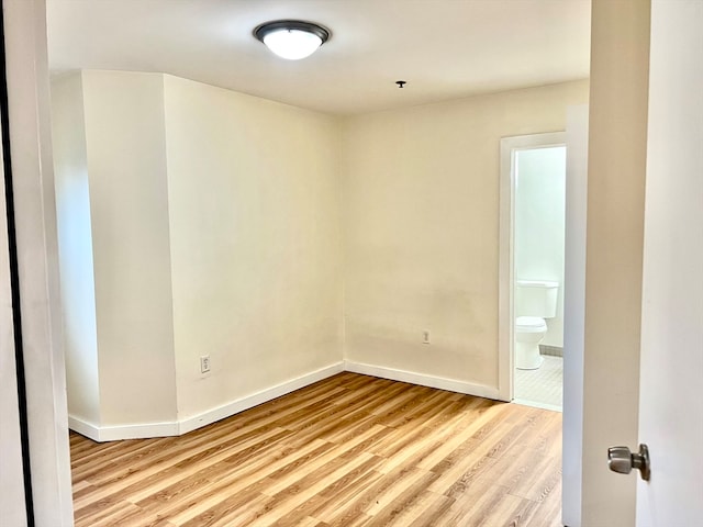 spare room with light wood-type flooring