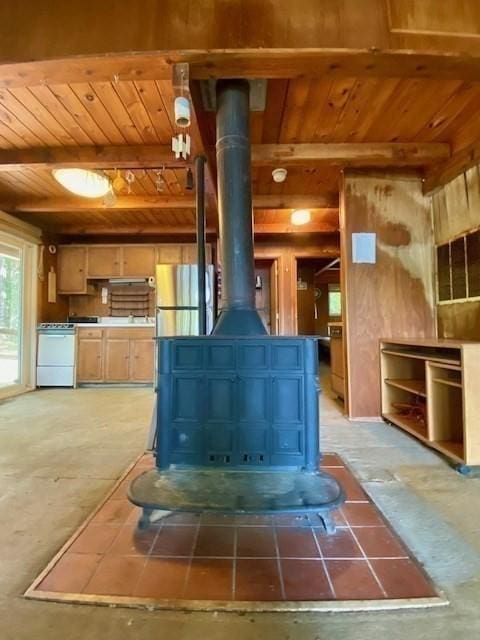 64E Old Princeton Rd, Hubbardston, MA 01452 - detailed view of freestanding refrigerator, a wood ceiling with exposed beams, a wood stove, and white dishwasher