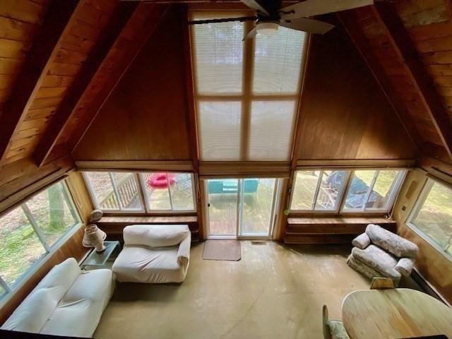 64E Old Princeton Rd, Hubbardston, MA 01452 - living area with healthy amount of natural light, wood ceiling, a ceiling fan, and wooden walls