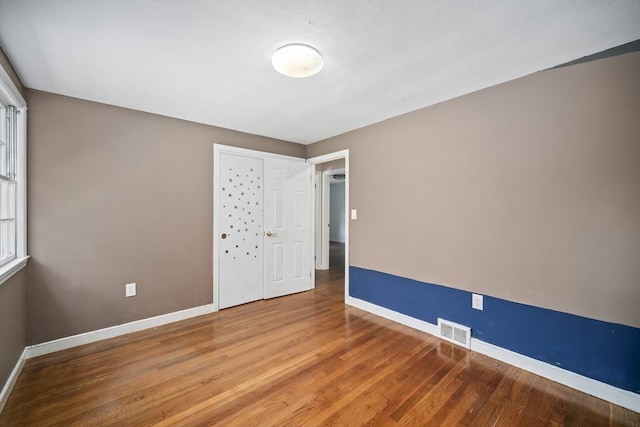 34 Clubhouse Ln, Natick, MA 01760 - spare room featuring baseboards and wood finished floors
