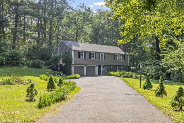 34 Clubhouse Ln, Natick, MA 01760 - colonial inspired home with a garage, a chimney, driveway, and a front lawn
