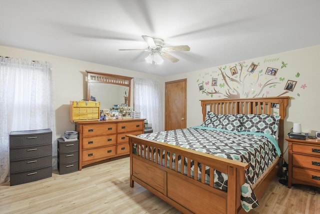 bedroom featuring a ceiling fan and light wood finished floors