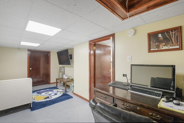 office with a paneled ceiling and baseboards