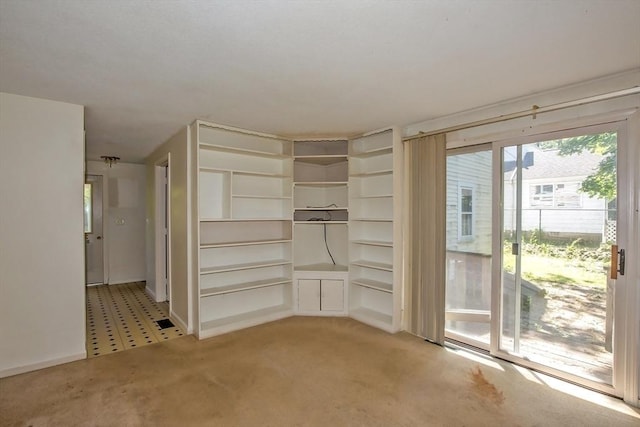 112 Harmon Ave, Springfield, MA 01118 - unfurnished dining area with light colored carpet and baseboards