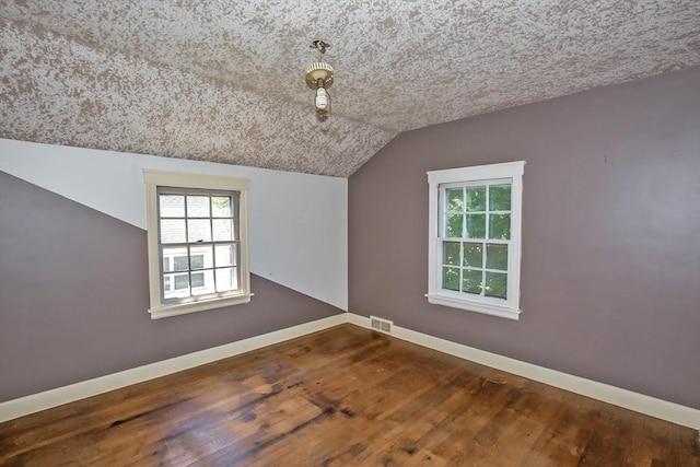 112 Harmon Ave, Springfield, MA 01118 - spare room with lofted ceiling and wood finished floors