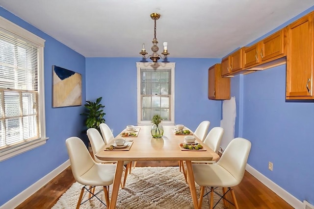 112 Harmon Ave, Springfield, MA 01118 - dining room featuring dark wood-style flooring and healthy amount of natural light
