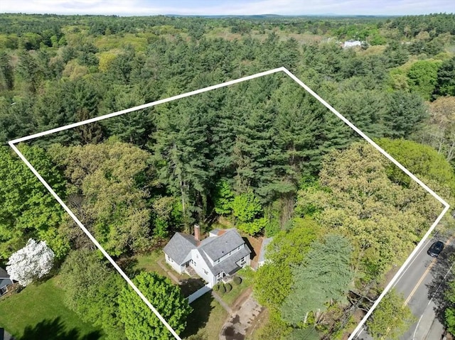 view of property location featuring a forest and property boundaries highlighted