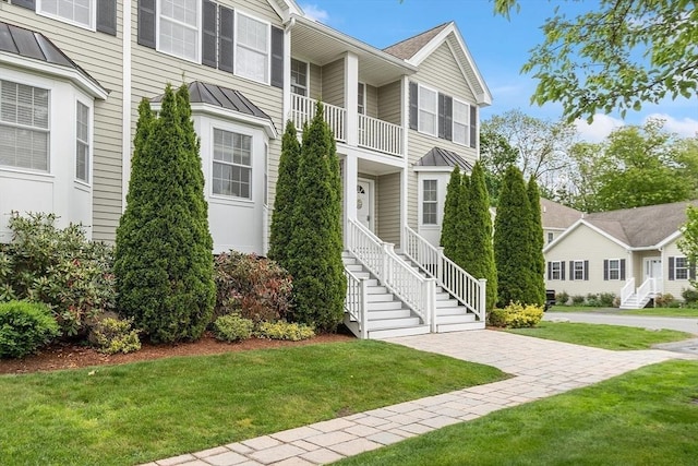 15 Coates Ln Unit 15, Haverhill, MA 01835 - multi unit property with a standing seam roof, a balcony, metal roof, a front yard, and stairs