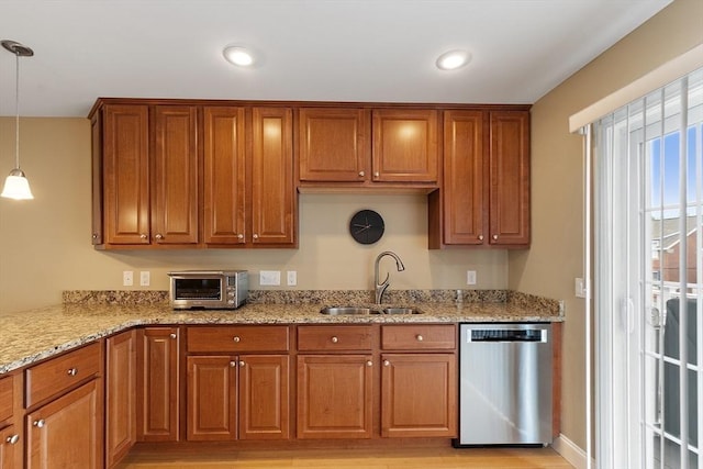 15 Coates Ln Unit 15, Haverhill, MA 01835 - kitchen featuring stainless steel dishwasher, a sink, brown cabinetry, decorative light fixtures, and light stone counters