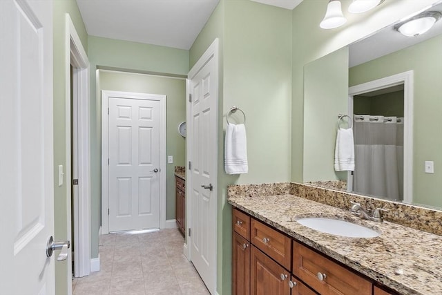 15 Coates Ln Unit 15, Haverhill, MA 01835 - bathroom featuring vanity, tile patterned flooring, and baseboards