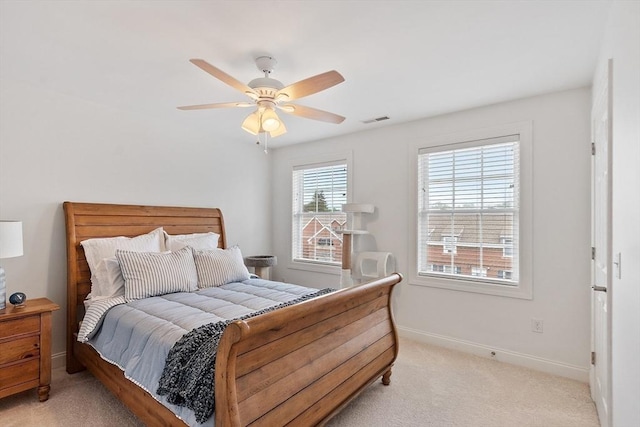 15 Coates Ln Unit 15, Haverhill, MA 01835 - bedroom with light carpet, baseboards, and a ceiling fan
