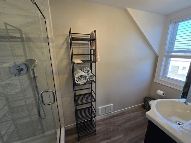 full bath featuring baseboards, a healthy amount of sunlight, visible vents, and a stall shower