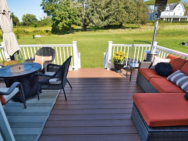 wooden deck featuring an outdoor hangout area and a lawn