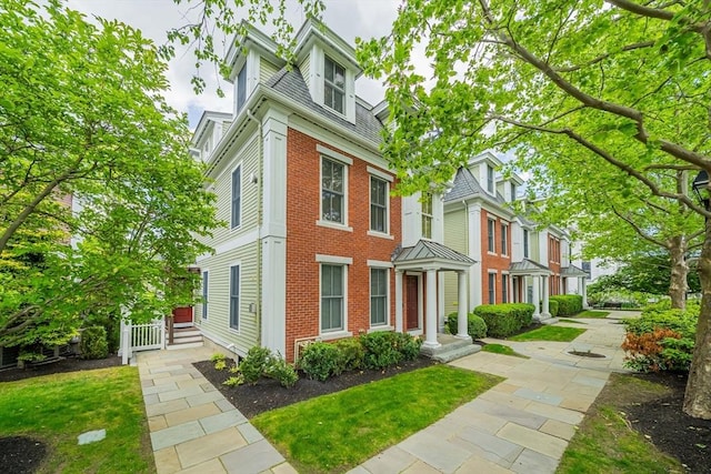 745-A Massachusetts Ave Unit A, Arlington, MA 02476 - view of front of house featuring brick siding and a residential view