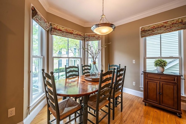 745-A Massachusetts Ave Unit A, Arlington, MA 02476 - dining room featuring plenty of natural light, baseboards, light wood-style flooring, and ornamental molding