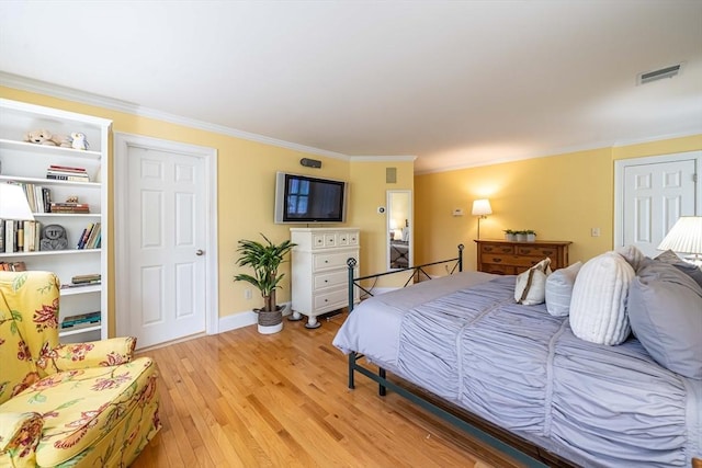 745-A Massachusetts Ave Unit A, Arlington, MA 02476 - bedroom featuring light wood finished floors, ornamental molding, and baseboards