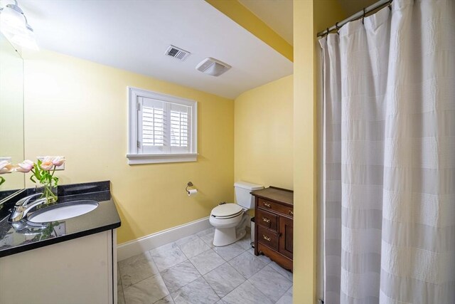 745-A Massachusetts Ave Unit A, Arlington, MA 02476 - full bath featuring vanity, toilet, baseboards, and marble finish floors