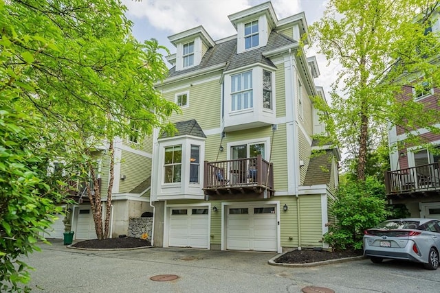 745-A Massachusetts Ave Unit A, Arlington, MA 02476 - view of front facade featuring driveway and a garage