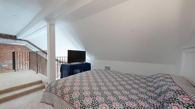 bedroom featuring carpet and lofted ceiling