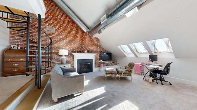 carpeted living room with lofted ceiling and brick wall