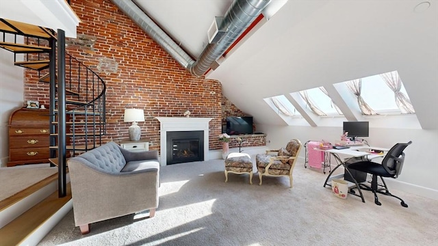 interior space featuring carpet, brick wall, and vaulted ceiling