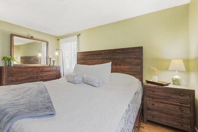 bedroom featuring wood finished floors