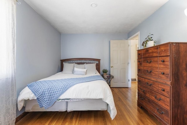 bedroom featuring wood finished floors