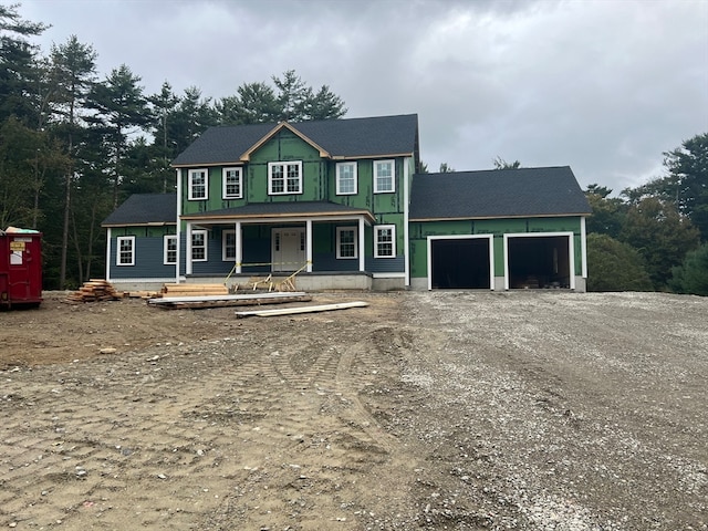 view of front of property with a porch and a garage