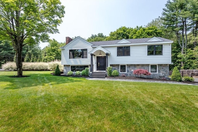 2 Overlook Rd, Canton, MA 02021 - raised ranch featuring a chimney, a front lawn, and stone siding