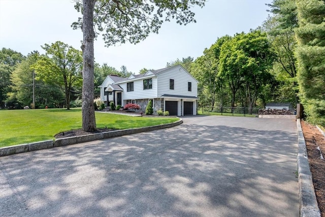 2 Overlook Rd, Canton, MA 02021 - view of front of property featuring a garage, stone siding, and driveway
