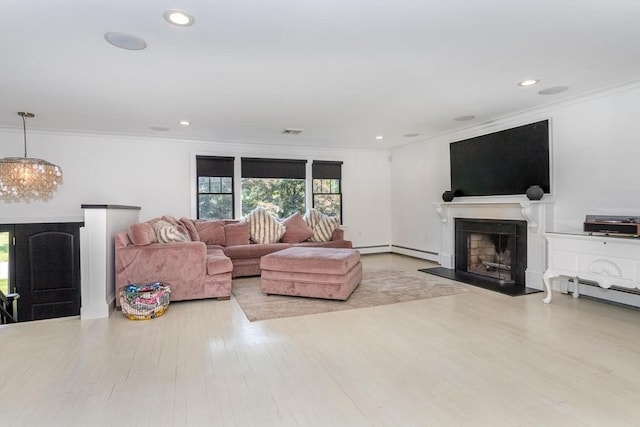 2 Overlook Rd, Canton, MA 02021 - living area with ornamental molding, wood finished floors, a fireplace, a chandelier, and a baseboard heating unit