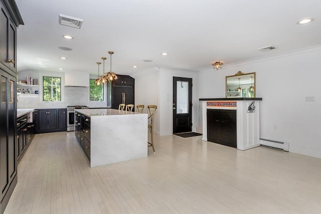 2 Overlook Rd, Canton, MA 02021 - kitchen featuring baseboard heating, stainless steel range oven, built in refrigerator, a kitchen island, and light wood-type flooring
